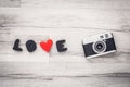 Candid, vintage camera on wooden retro background. Royalty Free Stock Photo