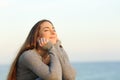 Candid woman breathing fresh air relaxing on the beach Royalty Free Stock Photo