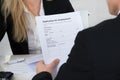 Candidate Holding Application Form In Front Of Interviewer Royalty Free Stock Photo
