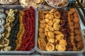 Candied apricots, peaches, figs,prunes, yellow and red cherries in plastic trays