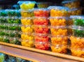 Candied citrus fruits kumquat in a containers on a store shelf. Candied kumquat, candied fruit, dried kumquat, vegetarian food Royalty Free Stock Photo