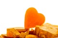 Candied fruit jelly apricot in the form of heart on isolated background Royalty Free Stock Photo