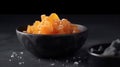 Candied ginger in black bowl, against dark background, Generative AI, AI generated