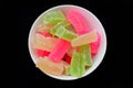 Candied jelly Manisan Agar-agar from Indonesia with red, green and yellow variations. very tasty and sweet. with a blank black