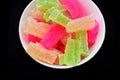 Candied jelly Manisan Agar-agar from Indonesia with red, green and yellow variations. very tasty and sweet. with a blank black
