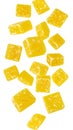 Candied lemon cubes falling on transparent background Royalty Free Stock Photo