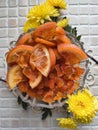 candied orange slices, fruit decor and yellow chrysanthemums