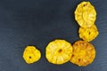 Candied pinapple rings , aka crystallized fruit on black background Royalty Free Stock Photo