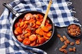 Candied sweet potatoes in a frying pan