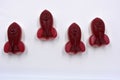 Candies, interesting rubber sweets in the form of red, cherry space rockets located on a white background.