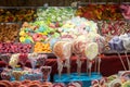 Candies, mainly gummy sweets and lollilpops, diversified, display in loose in a candy shop during a carnival or a fair