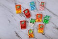 Candies variety of Tic Tac in the mint boxes of packages on old wood background