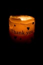 Candle burning with thank you text Royalty Free Stock Photo