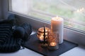 Candle and aroma stick on windowsill. Concept of relax, tranquil, peaceful, unplug, balanced time, Keep kalm and take it easy,