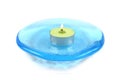 Candle on a blue glass dish Royalty Free Stock Photo