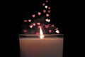 Candle with bokeh red hearts shape background rising soaring up. Vintage style.