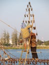 Candle bottles filled with oil on floating metal frame