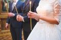 Candle in Bride's Hands Royalty Free Stock Photo