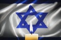 A candle is burning against the background of the official flag of Israel. Commemoration of the dead, victims of the Holocaust and