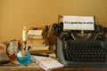 candle burning in candlestick, stack old books, letters, vintage typewriter with good day to write, creative process and literary Royalty Free Stock Photo