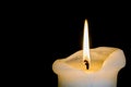 Candle Burning Down over Black Background Royalty Free Stock Photo