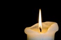 Candle Burning Down over Black Background Royalty Free Stock Photo