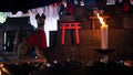 Candle burning in small temple with Kitsune japanese fox statue at Fushimi Inari Royalty Free Stock Photo