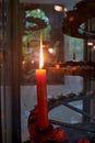 A candle burns in a candleholder in a Japanese temple. Japan