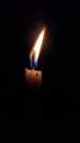 A candle that burns in the dark. Royalty Free Stock Photo