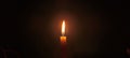 a candle that burns in the dark Royalty Free Stock Photo
