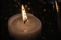 Candle burns at dusk, a candle fire on a black background Royalty Free Stock Photo