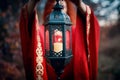 Woman holding a lantern with a candle. Royalty Free Stock Photo