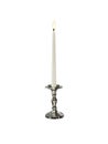 Candle on candlestick isolated on white background Royalty Free Stock Photo