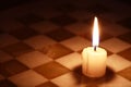 Candle On Chessboard Royalty Free Stock Photo