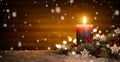 Candle and Christmas decoration with wooden background and snow Royalty Free Stock Photo