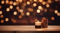 Candle and christmas decoration on wooden table over bokeh background Royalty Free Stock Photo