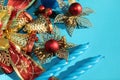 Candle and Christmas decorations on blue background Royalty Free Stock Photo