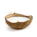 Candle in coconut. Close up. Isolated on a white background Royalty Free Stock Photo