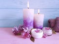 Candle cream fresh cosmetic aroma extract towel on a wooden background