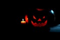 Candle and creepy smiling pumpkin for Halloween