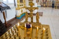 Orenburg, Russian Federation-2 Aprel 2019. the candle and the cross in the Orthodox Church