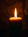 Candle on dark background. Royalty Free Stock Photo