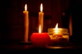 Candle on dark background. Candle in low key. Candle flame at night closeup Royalty Free Stock Photo
