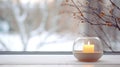 Candle in elegant glass candleholder on a windowsill, with winter landscape and trees seen through the window. Generative AI