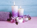 Candle cream fresh cosmetic aroma towel on a wooden background