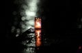 Candle flame with abstract bokeh background during the rain in the city. Vespers Royalty Free Stock Photo