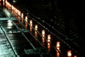 Candle flame with abstract bokeh background during the rain in the city. Vespers Royalty Free Stock Photo