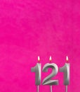 Candle 121 with flame - Birthday card in fuchsia background