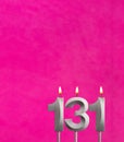 Candle 131 with flame - Birthday card in fuchsia background