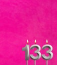 Candle 133 with flame - Birthday card in fuchsia background